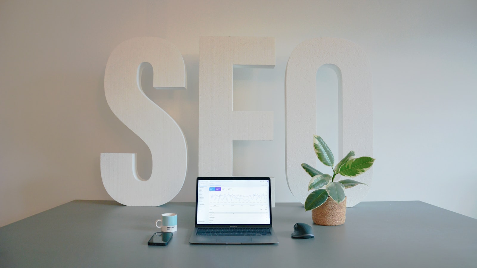 Modern marketing workspace with analytics dashboards showing campaign performance optimization metrics